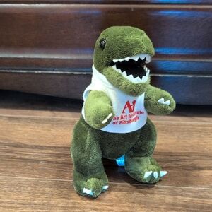 Green Dinosaur Plush with Art Institute Logo Shirt